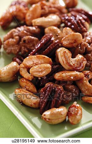 Assorted roasted nuts View Large Photo Image Stock Photo - Assorted roasted nuts. Fotosearch