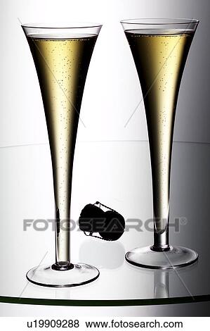 Champagne flutes and cork View Large Photo Image Stock Photo - Champagne flutes and cork. Fotosearch