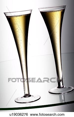 Champagne flutes View Large Photo Image Stock Photograph - Champagne flutes. Fotosearch
