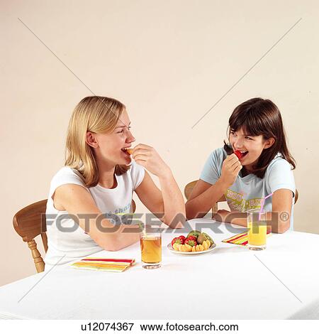 Children eating and drinking View Large Photo Image Stock Photo - Children eating and drinking. Fotosearch