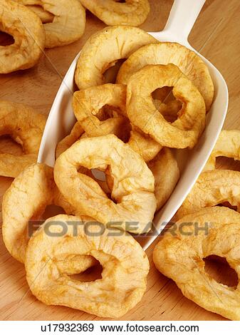 Stock Photo - Dried Apple Rings in Scoop - Non Exclusive. Fotosearch