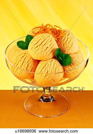 Ice cream on orange View Large Photo Image Stock Photograph - Ice cream on orange. Fotosearch