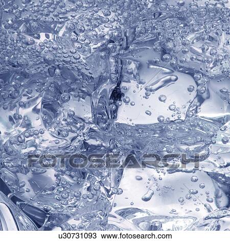 Stock Image - Ice in fizzy liquid. Fotosearch