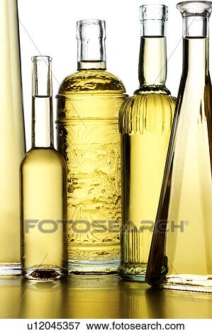 Oil bottles View Large Photo Image Stock Photo - Oil bottles. Fotosearch