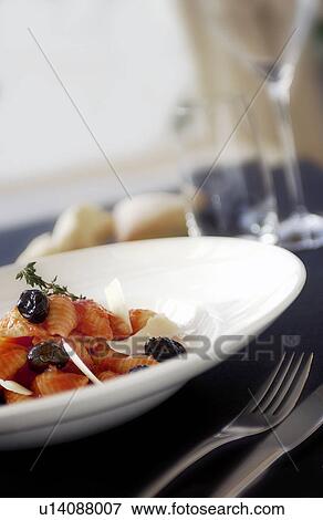 Olive and tomato pasta View Large Photo Image Stock Photo - Olive and tomato pasta. Fotosearch