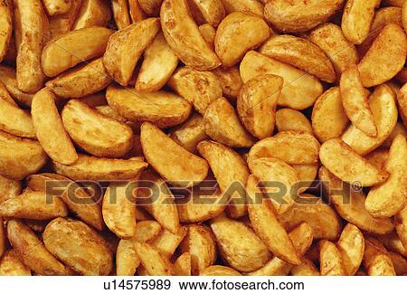 Potato wedges View Large Photo Image Stock Photo - Potato wedges. Fotosearch