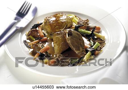 Stock Image - Roast pigeon and foie gras. Fotosearch