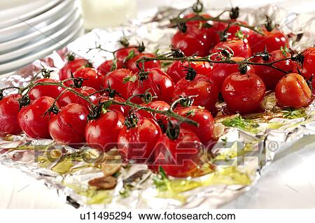 Roasted Cherry Vine Tomatoes - Non Exclusive View Large Photo Image Picture - Roasted Cherry Vine Tomatoes - Non Exclusive. Fotosearch