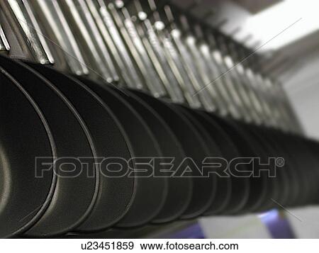 Stock Photo - Row of cooks pans. Fotosearch