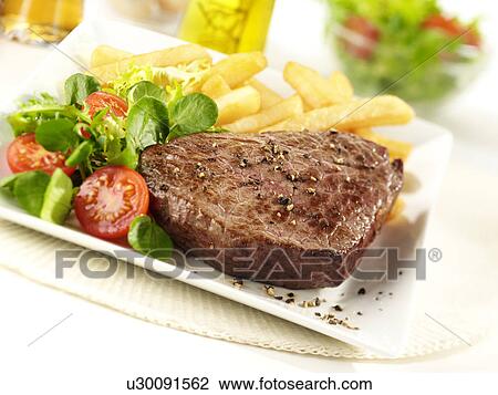 Stock Image - Steak Chips And Salad - Non Exclusive. Fotosearch