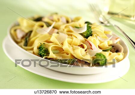Stock Image - Tagliatelle with broccoli and parmesan sauce. Fotosearch