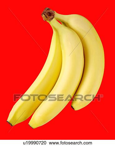 Stock Image - Three Bananas on Red - Non Exclusive. Fotosearch