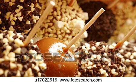 Toffee apples covered, chocolate chips View Large Photo Image Stock Photography - Toffee apples covered, chocolate chips. Fotosearch