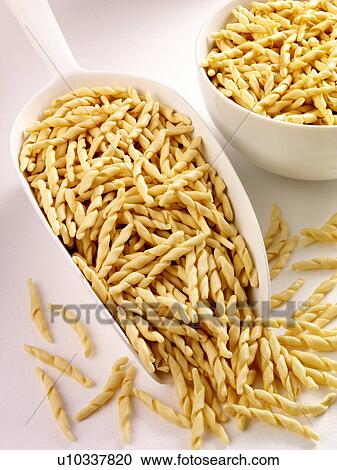 Trofie Pasta in Scoop - Non Exclusive View Large Photo Image Stock Image - Trofie Pasta in Scoop - Non Exclusive. Fotosearch