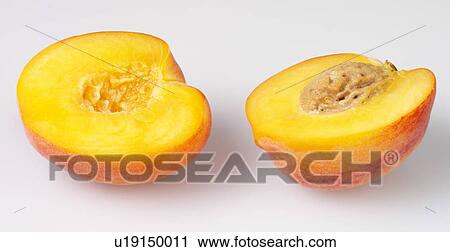Stock Image - Two Peach Halves - Non Exclusive. Fotosearch