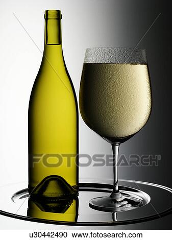 Stock Image - White Wine Glass And Bottle - Non Exclusive. Fotosearch