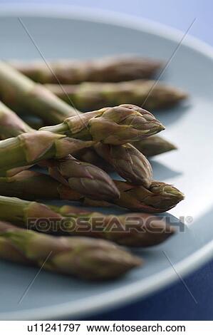 Asparagus spears on plate View Large Photo Image Stock Photo - Asparagus spears on plate. Fotosearch
