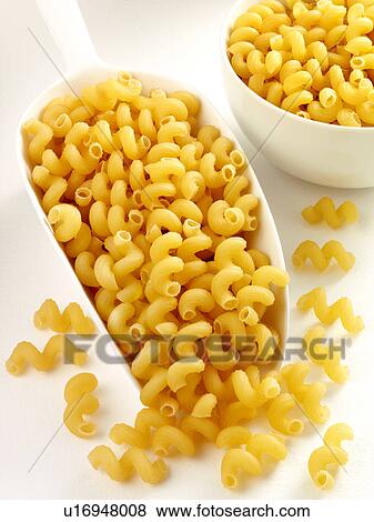 Cellentani Pasta in Scoop - Non Exclusive View Large Photo Image Stock Photo - Cellentani Pasta in Scoop - Non Exclusive. Fotosearch