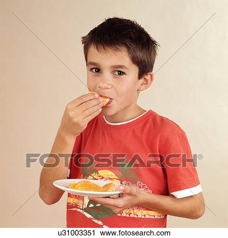 Child eating orange View Large Photo Image Stock Image - Child eating orange. Fotosearch