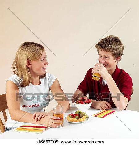 Stock Photo - Children eating and drinking. Fotosearch