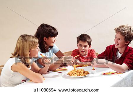 Picture - Children eating. Fotosearch