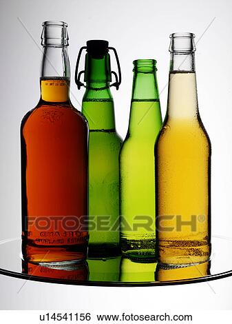 Stock Photograph - Four Beer Bottles - Non Exclusive. Fotosearch