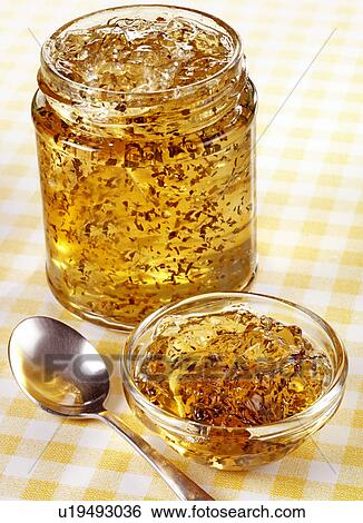 Stock Photograph - Golden Mint Jelly Without Label- Non Exclusive. Fotosearch