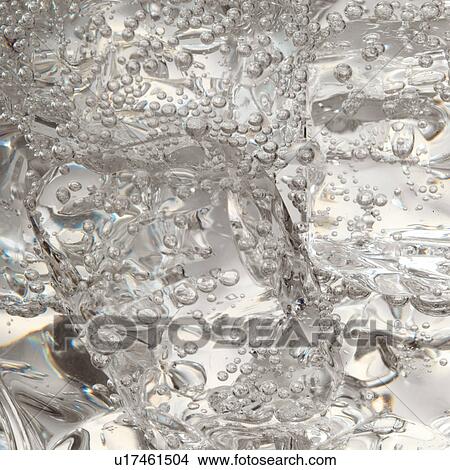 Picture - Ice in fizzy liquid. Fotosearch