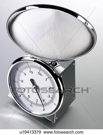 Stock Photo - Kitchen Scales With Salt - Non Exclusive. Fotosearch