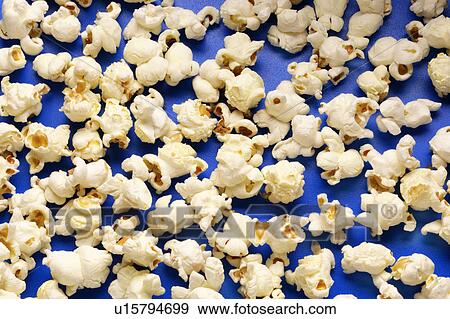 Popcorn on blue View Large Photo Image Stock Photo - Popcorn on blue. Fotosearch