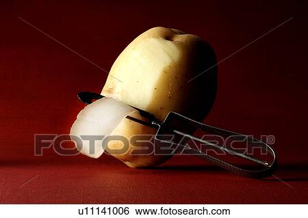 Potato and potato peeler View Large Photo Image Stock Photograph - Potato and potato peeler. Fotosearch