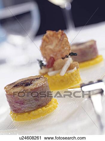 red mullet on a bed of saffron risotto View Large Photo Image Stock Image - red mullet on a bed of saffron risotto. Fotosearch
