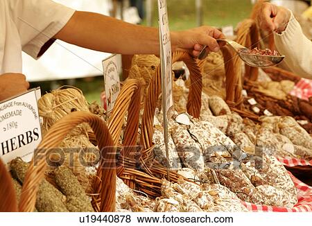 Stock Photo - Sausage Tasting, French Sausage Market Stall, Bath, england. Fotosearch