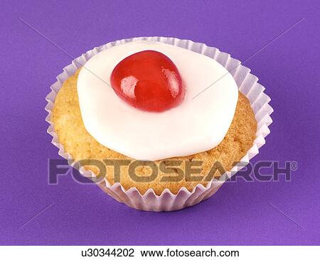 Stock Image - Single Cherry Cupcake on Purple - Non Exclusive. Fotosearch