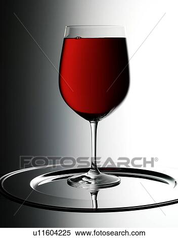 Stock Photography - Single Glass of Red Wine With Bubbles - Non Exclusive. Fotosearch