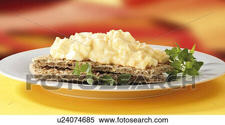 Stock Photography - srambled egg on crisp bread. Fotosearch