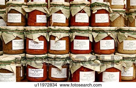 Picture - Stacks of pesto jars. Fotosearch