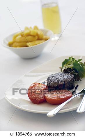 Stock Photography - Steak and chips with beer. Fotosearch