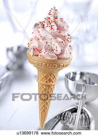 Stock Photo - Strawberry Ice Cream Cone With Sprinkles - Non Exclusive. Fotosearch
