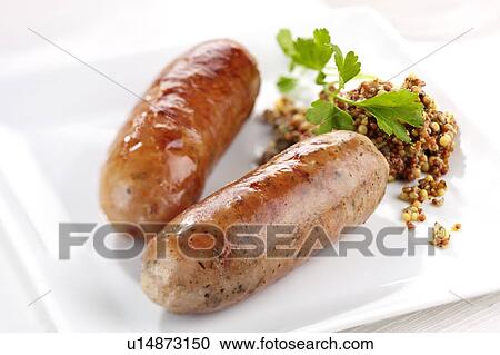 Stock Image - Two Herb Sausages- Non Exclusive. Fotosearch