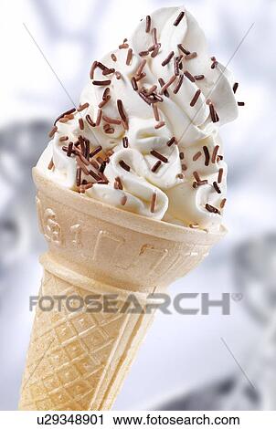 Stock Image - Vanilla Ice Cream Cone With Chocolate Sprinkles - Non Exclusive. Fotosearch