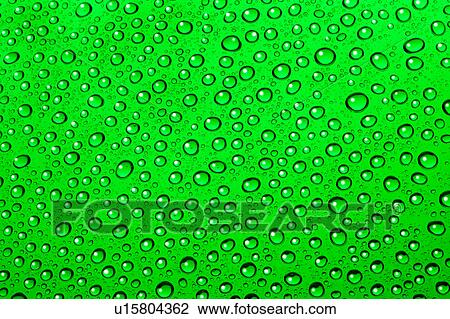 Stock Image - Water drops on green. Fotosearch
