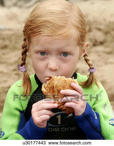 Young girl eating a Traditional Cornish Pasty View Large Photo Image Stock Image - Young girl eating a Traditional Cornish Pasty. Fotosearch