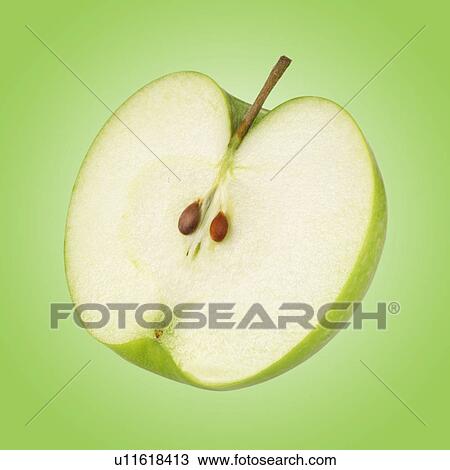 Stock Image - Apple Half On Green. Fotosearch