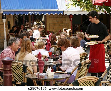 Stock Photography - Being served, a street cafe. Fotosearch