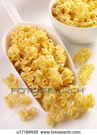 Stock Photo - Capricci Pasta in Scoop - Non Exclusive. Fotosearch