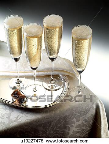 Stock Photo - Champagne on a tray. Fotosearch