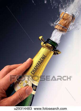 Stock Image - Champagne popping. Fotosearch