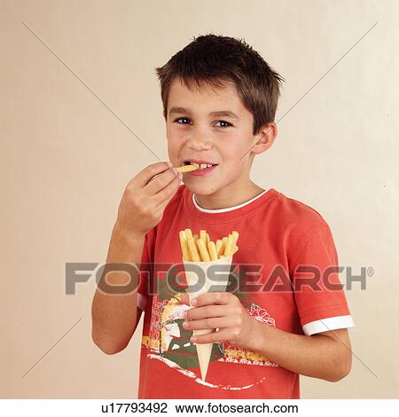 Child eating pastry sticks View Large Photo Image Stock Image - Child eating pastry sticks. Fotosearch