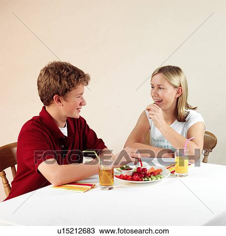 Stock Image - Children eating and drinking. Fotosearch